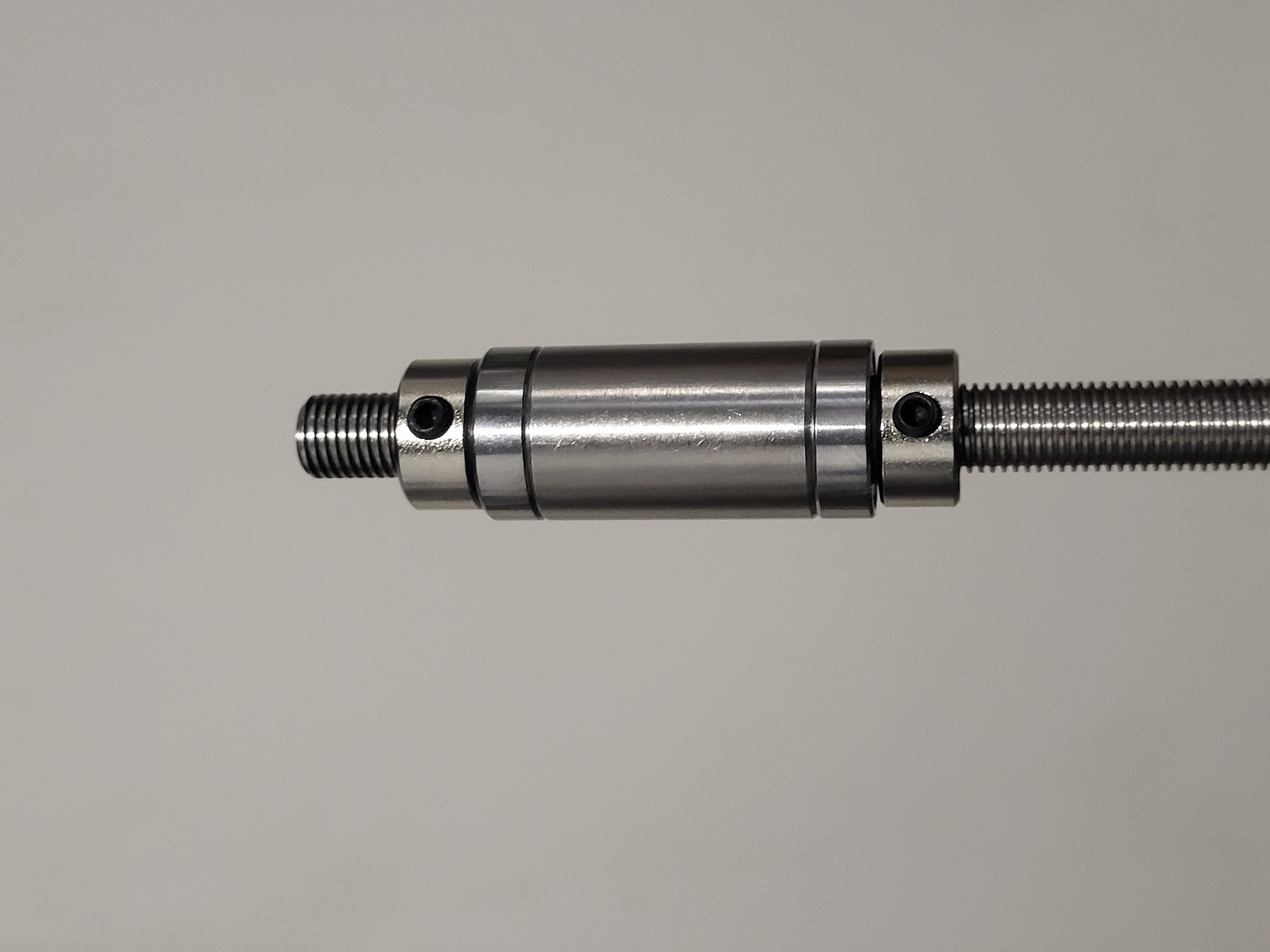 Bearing block assembly showing lock nuts, bearings, washers and spacers mounted on T8 leadscrew