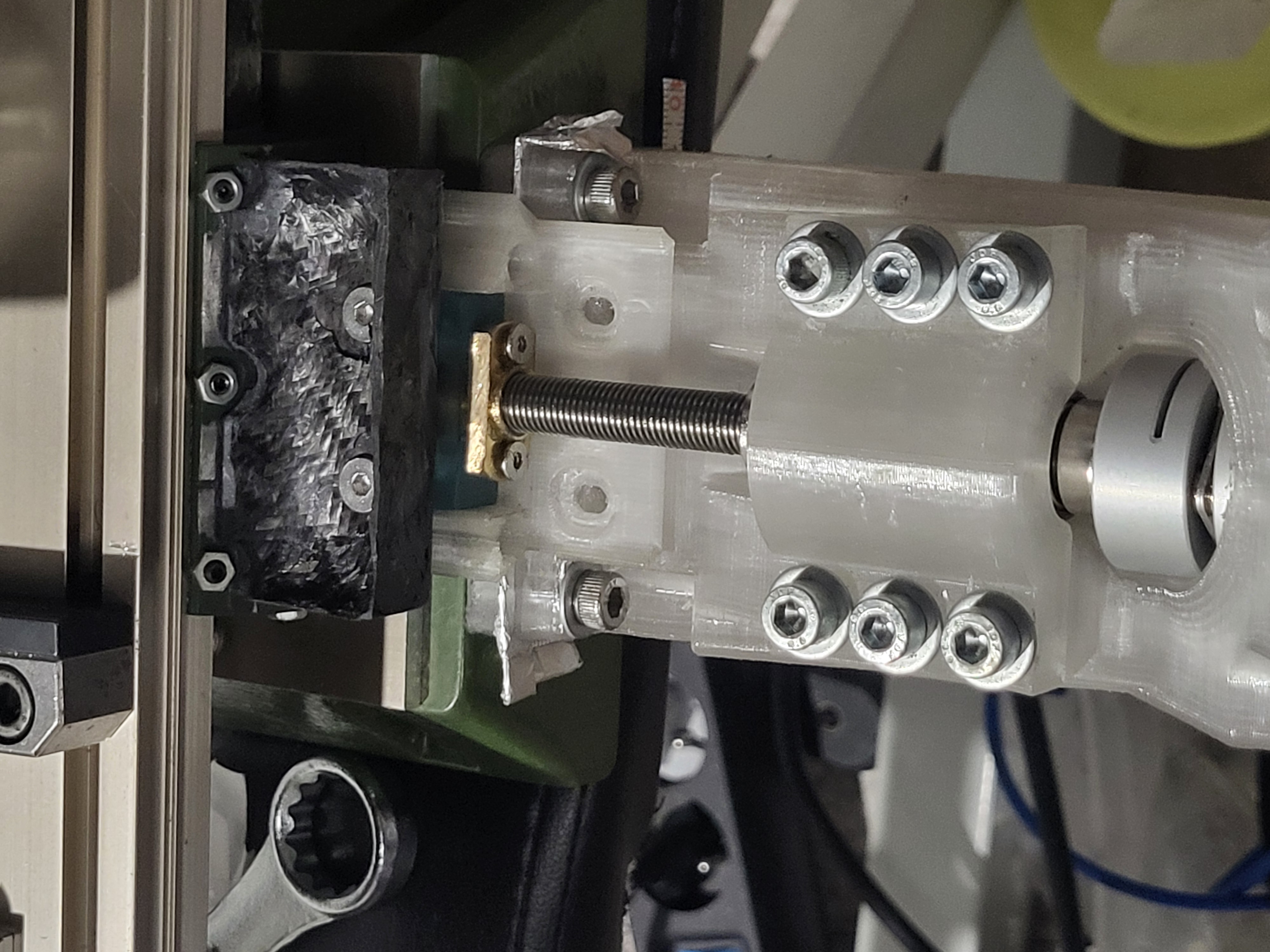 Y-axis assembly showing motor mount, bearing block, leadscrew, anti-backlash nut, carbon fiber bracket, and Proxxon sliding carriage